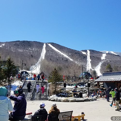 Photo of base area of Sugarbush Resort with ski runs in the background